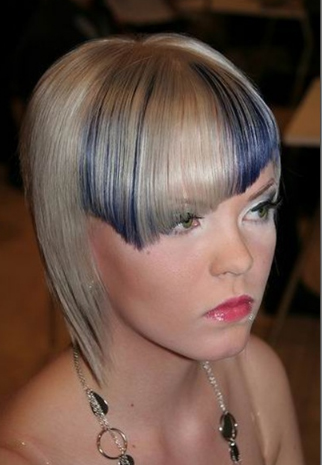 Stunning platinum blonde edgy haircut with dark blue accents through out