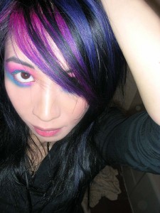 Play around with vivid colors for you streak, after all most colors look great when contrasting with black hair