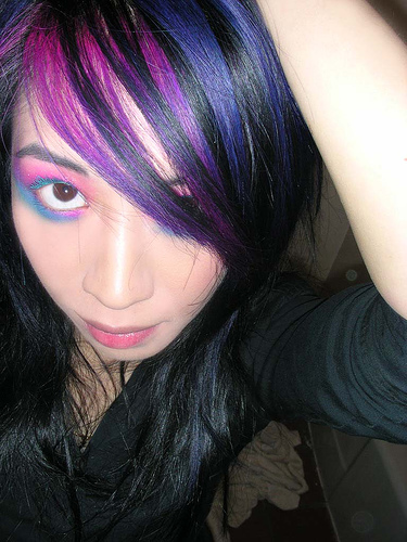 brown hair with purple streaks. Play around with vivid colors for your streak, after all most colors look 