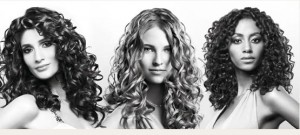 Curly Hair looks best when it is from medium to long length with long laers cut in.