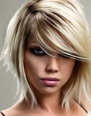 Medium Length Layered Haircuts With Side Bangs. Side swept band on layered