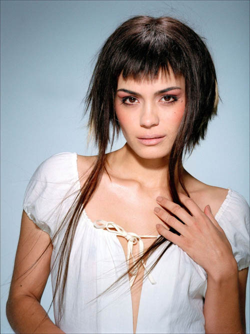 Modern asymmetric haircut with very long bits at the front.