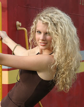 Taylor-Swift-big-hair. Posted under: