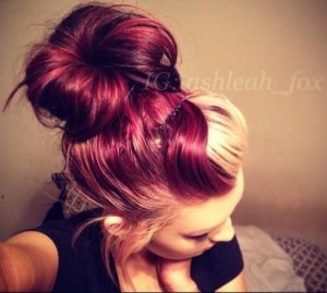 Rich red hair with blonde bangs tied in a bun